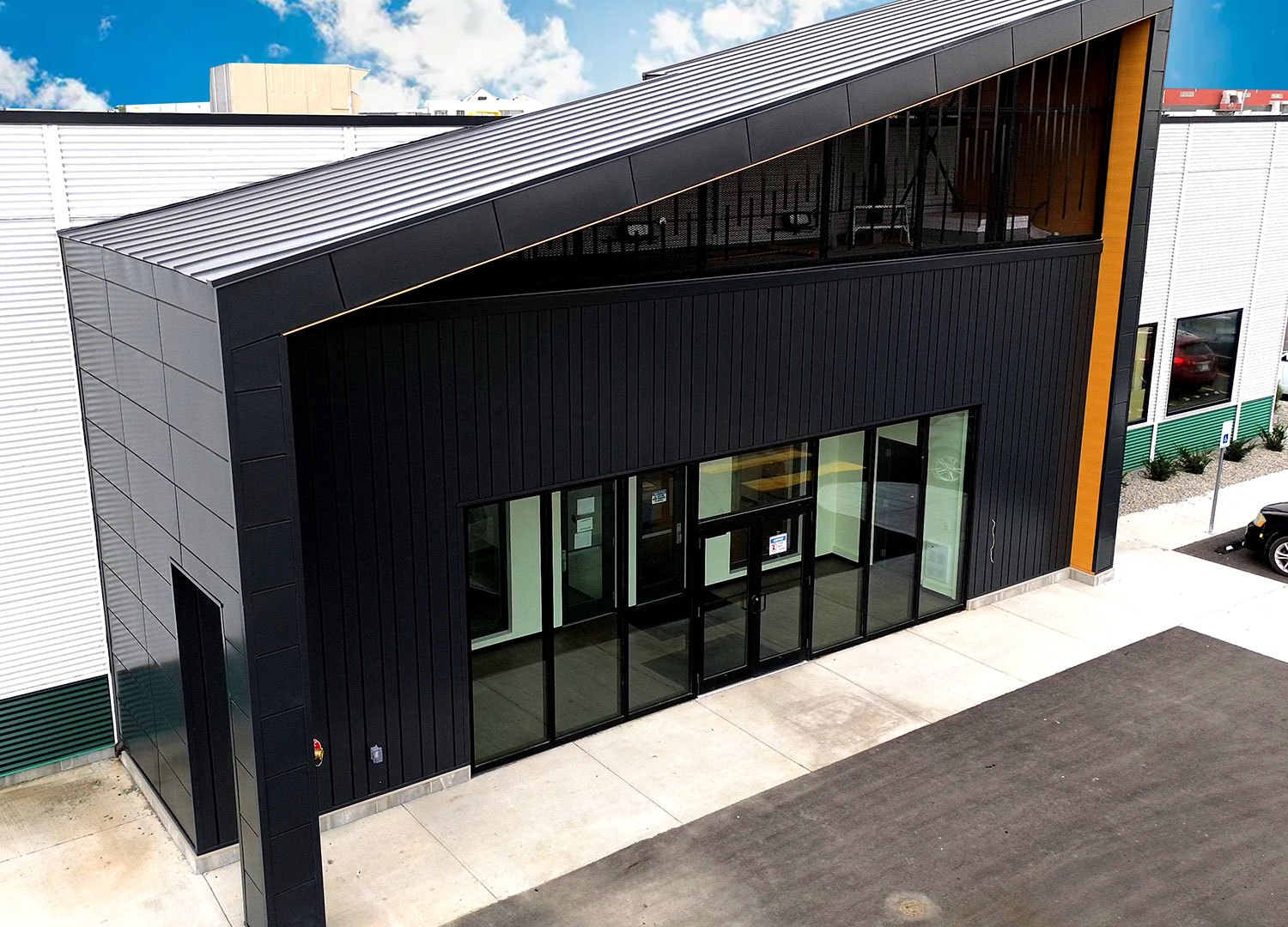 Commercial Building with Expand Modular Panels in Carbon and Interlock 8" in Autumn.