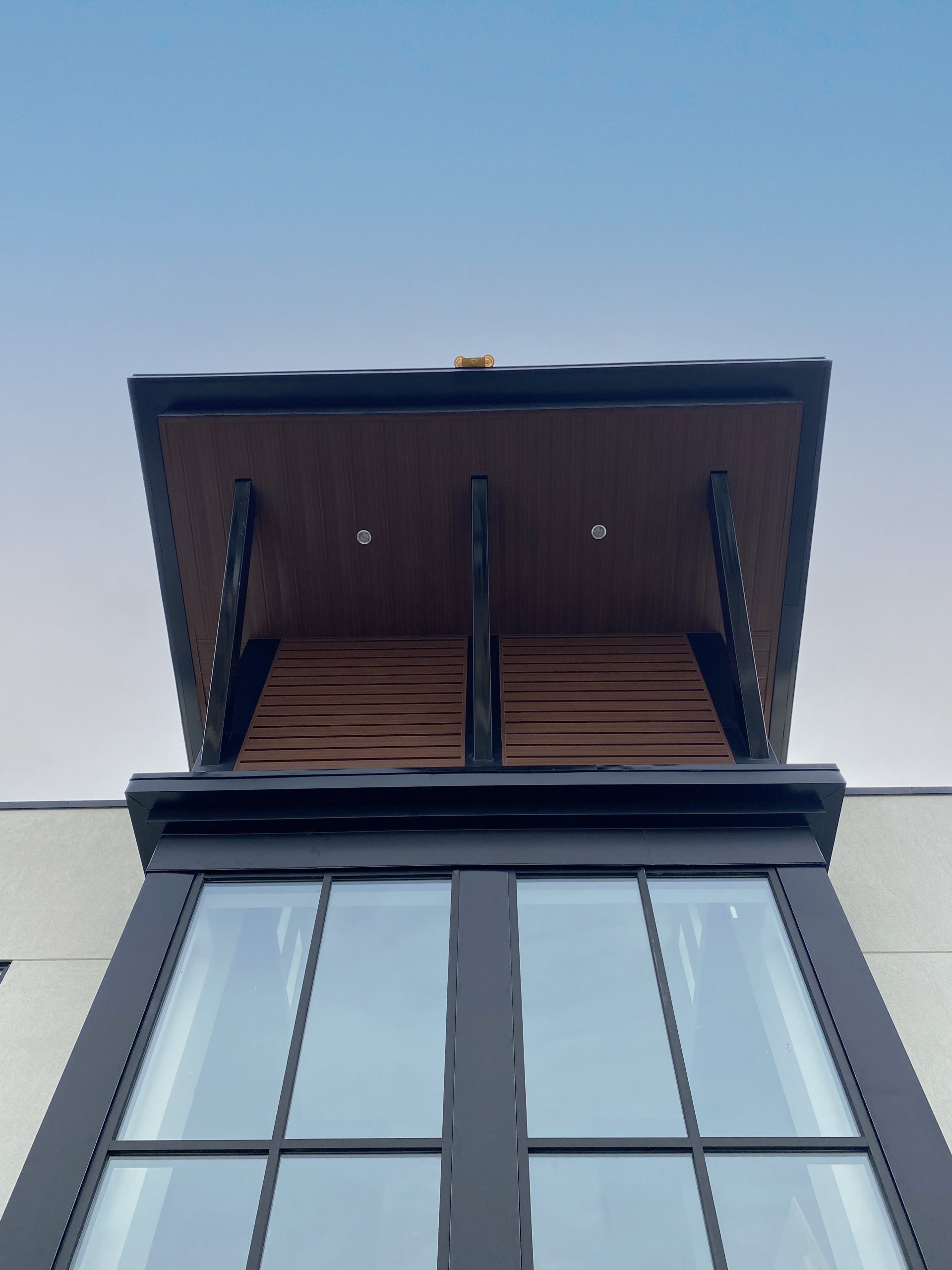 Forma Plank in Espresso Woodgrain and InterLoc Soffit in Espresso Woodgrain